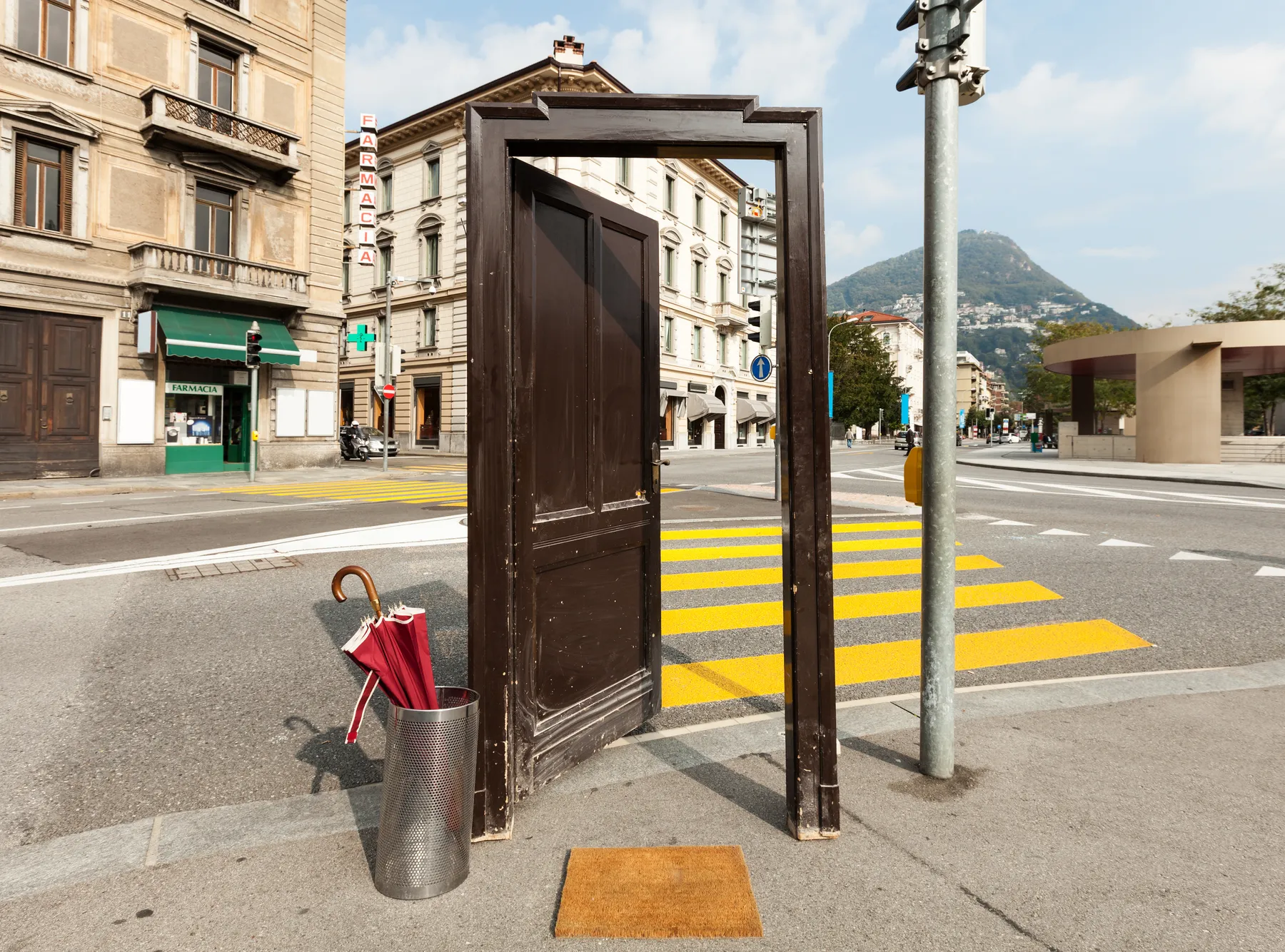 An open door standing on a city street
